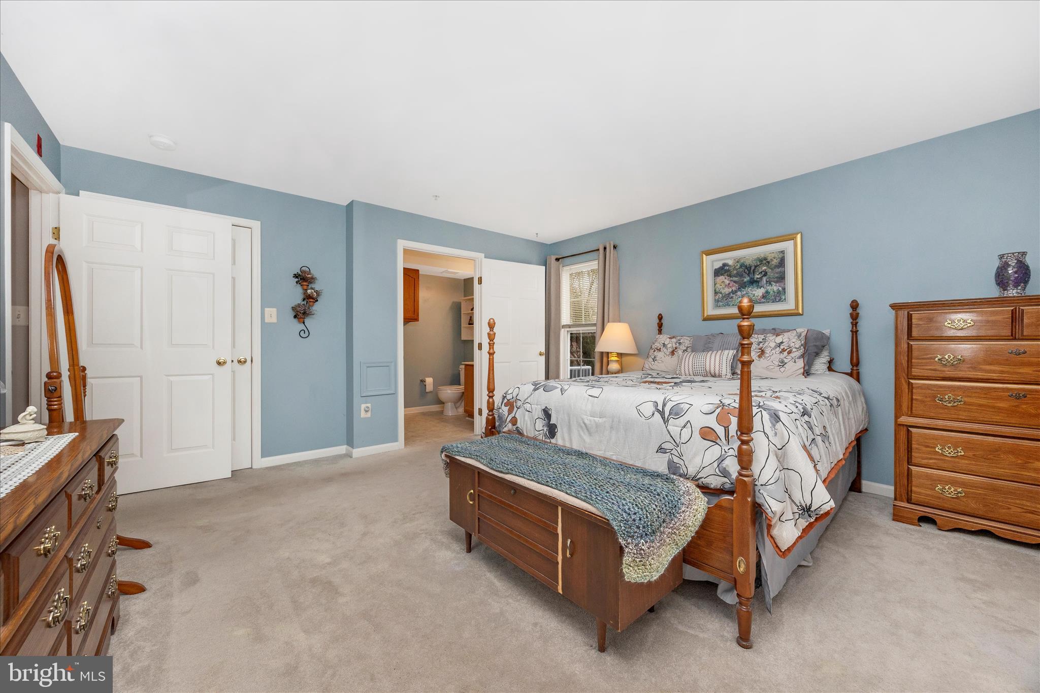 25900 Ridge Manor Drive, Unit 6000B Damascus, MD 20872 - Photo 27 of 39 a bed room with a bed and a television