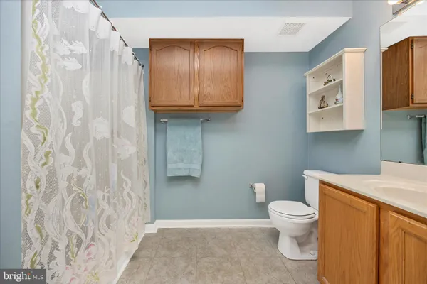 a bathroom with a toilet and a sink
