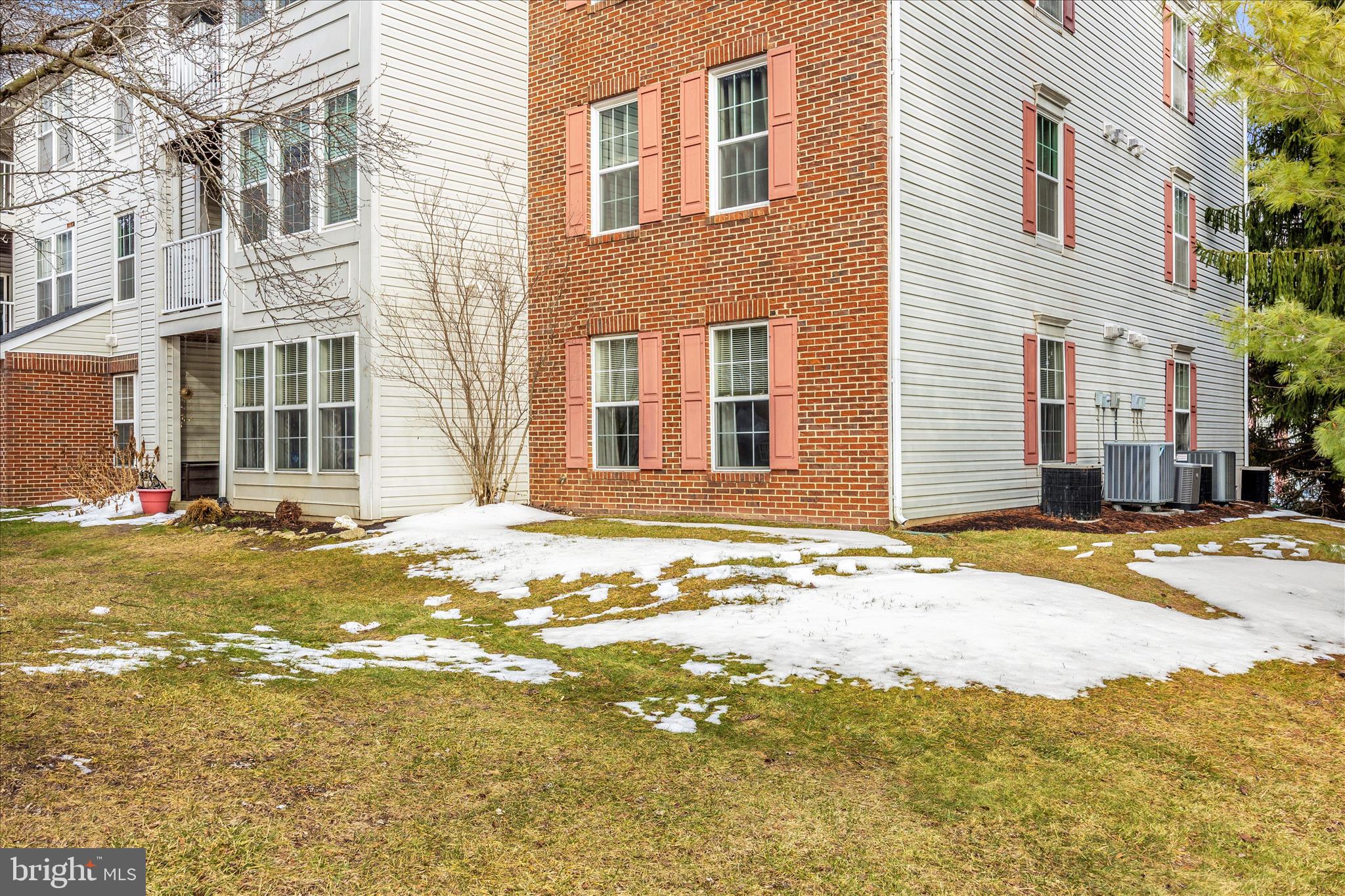 25900 Ridge Manor Drive, Unit 6000B Damascus, MD 20872 - Photo 34 of 39 a view of a house with a backyard