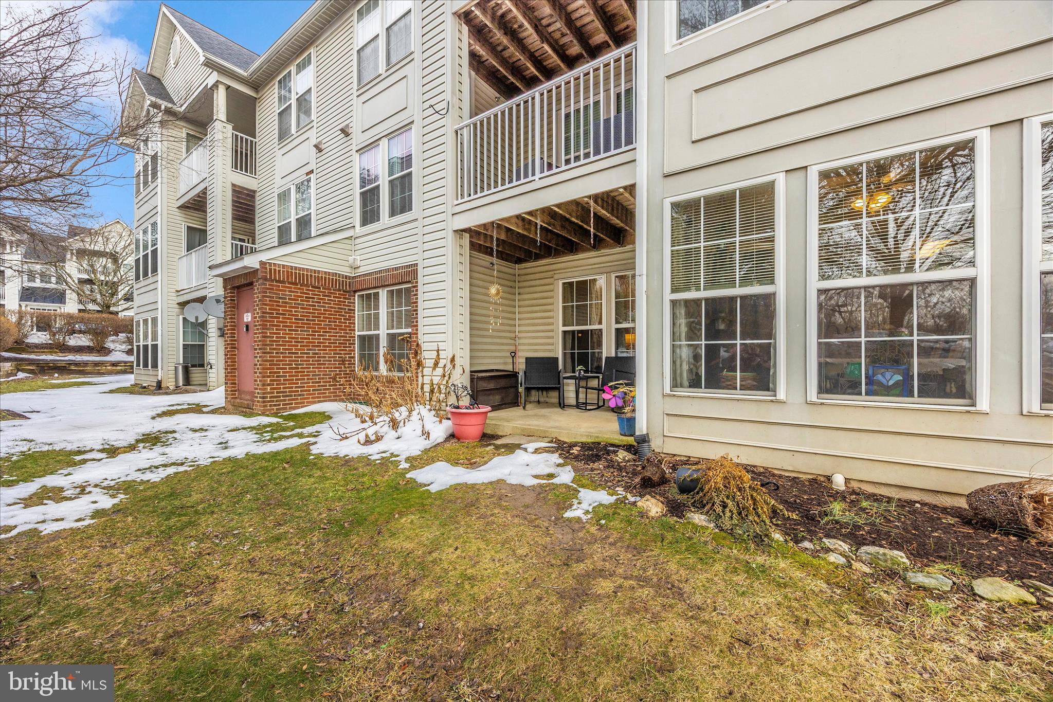 25900 Ridge Manor Drive, Unit 6000B Damascus, MD 20872 - Photo 36 of 39 a front view of a house with a yard