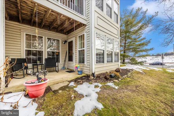 a front view of a house with outdoor seating