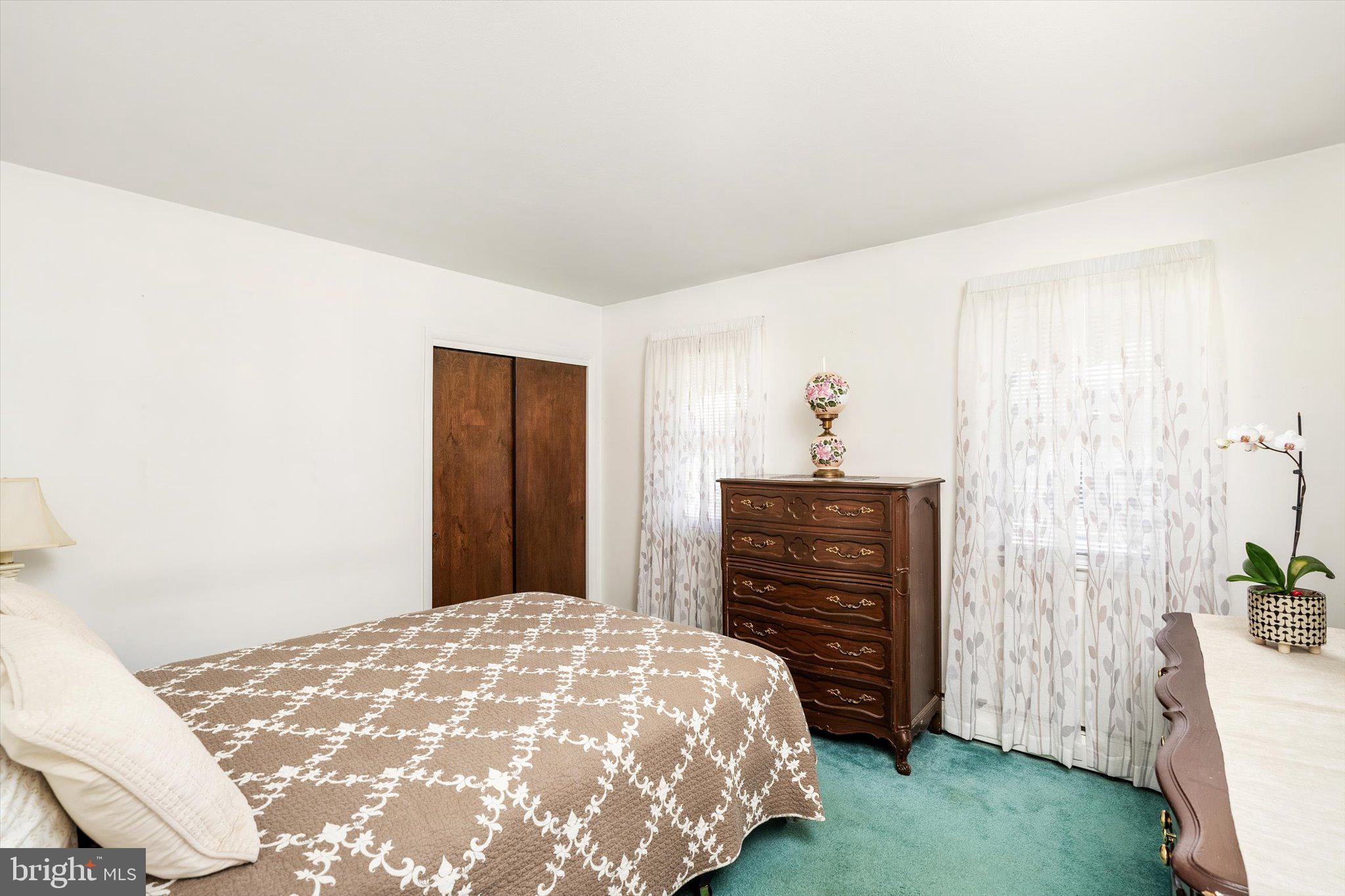 151 Walnford Road Allentown, NJ 08501 - Photo 20 of 49 a bedroom with a bed and a dresser