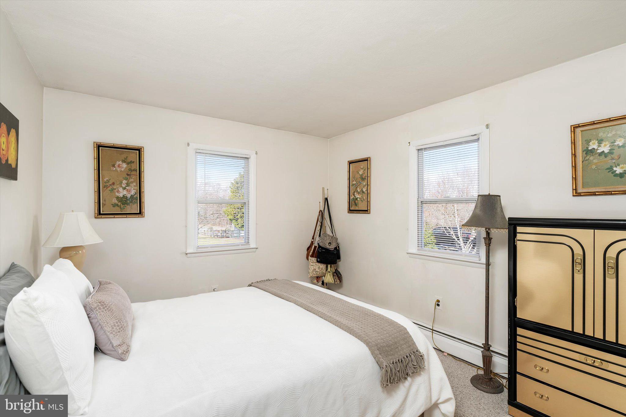 151 Walnford Road Allentown, NJ 08501 - Photo 22 of 49 a bedroom with a bed and wooden floor