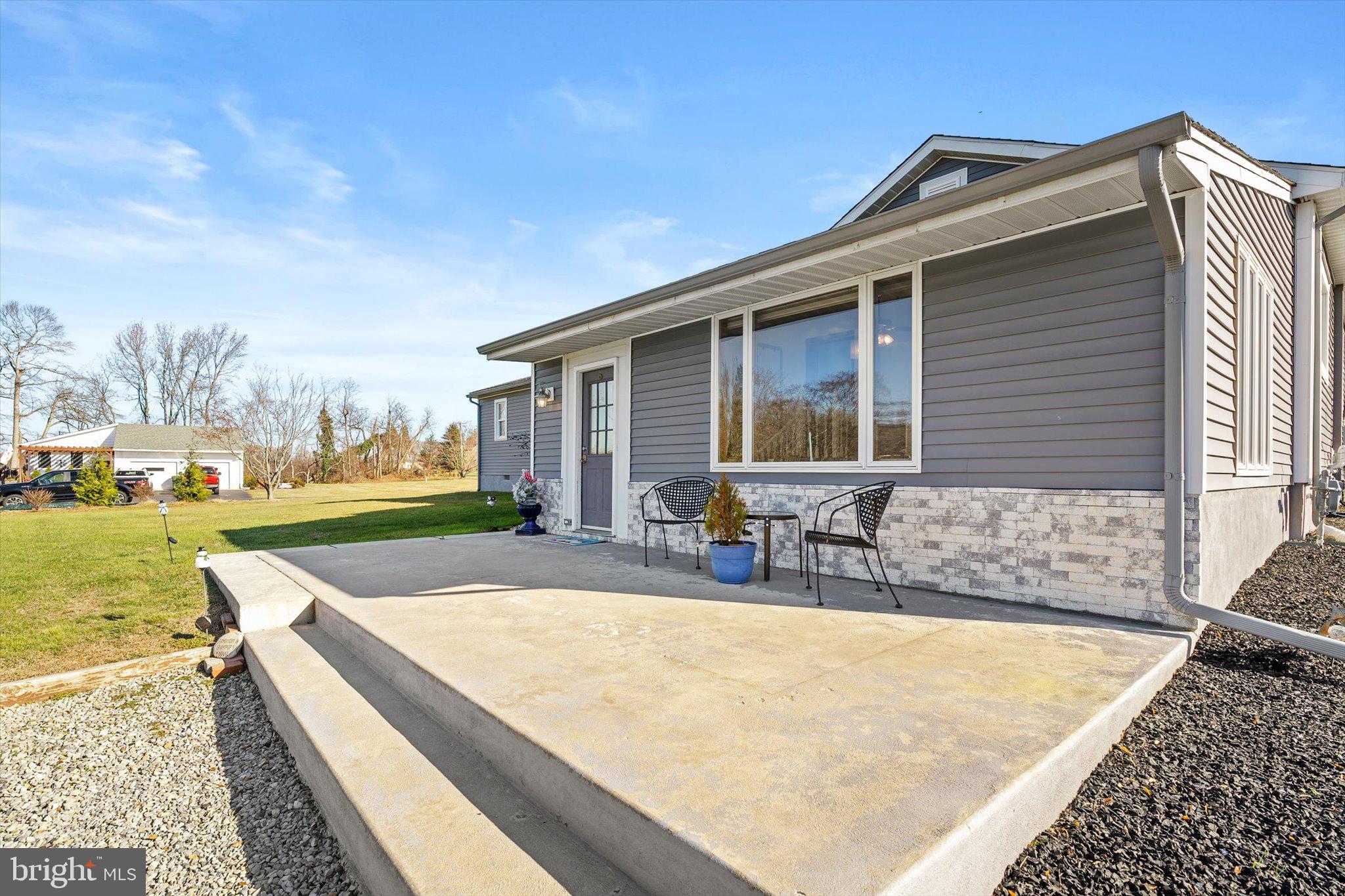 151 Walnford Road Allentown, NJ 08501 - Photo 27 of 49 a view of a house with swimming pool and sitting area