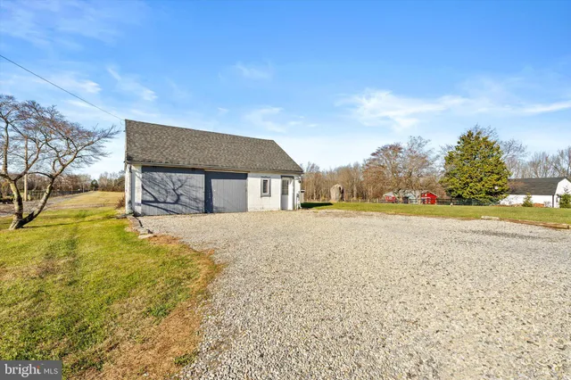 a house view with swimming pool in front of it