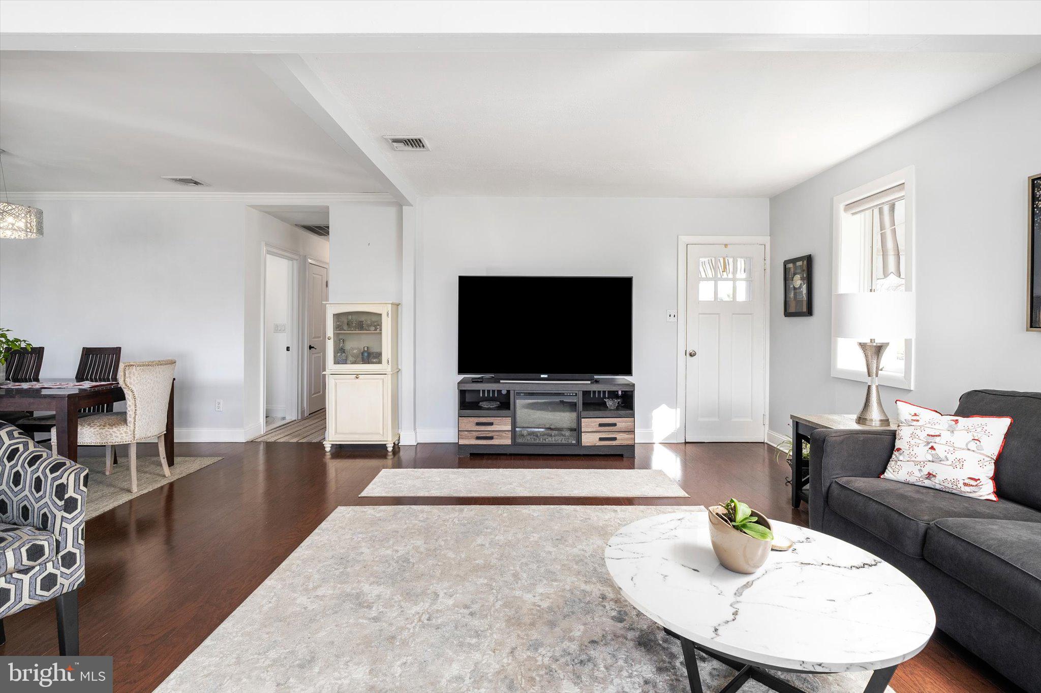 151 Walnford Road Allentown, NJ 08501 - Photo 4 of 49 a living room with furniture and a flat screen tv