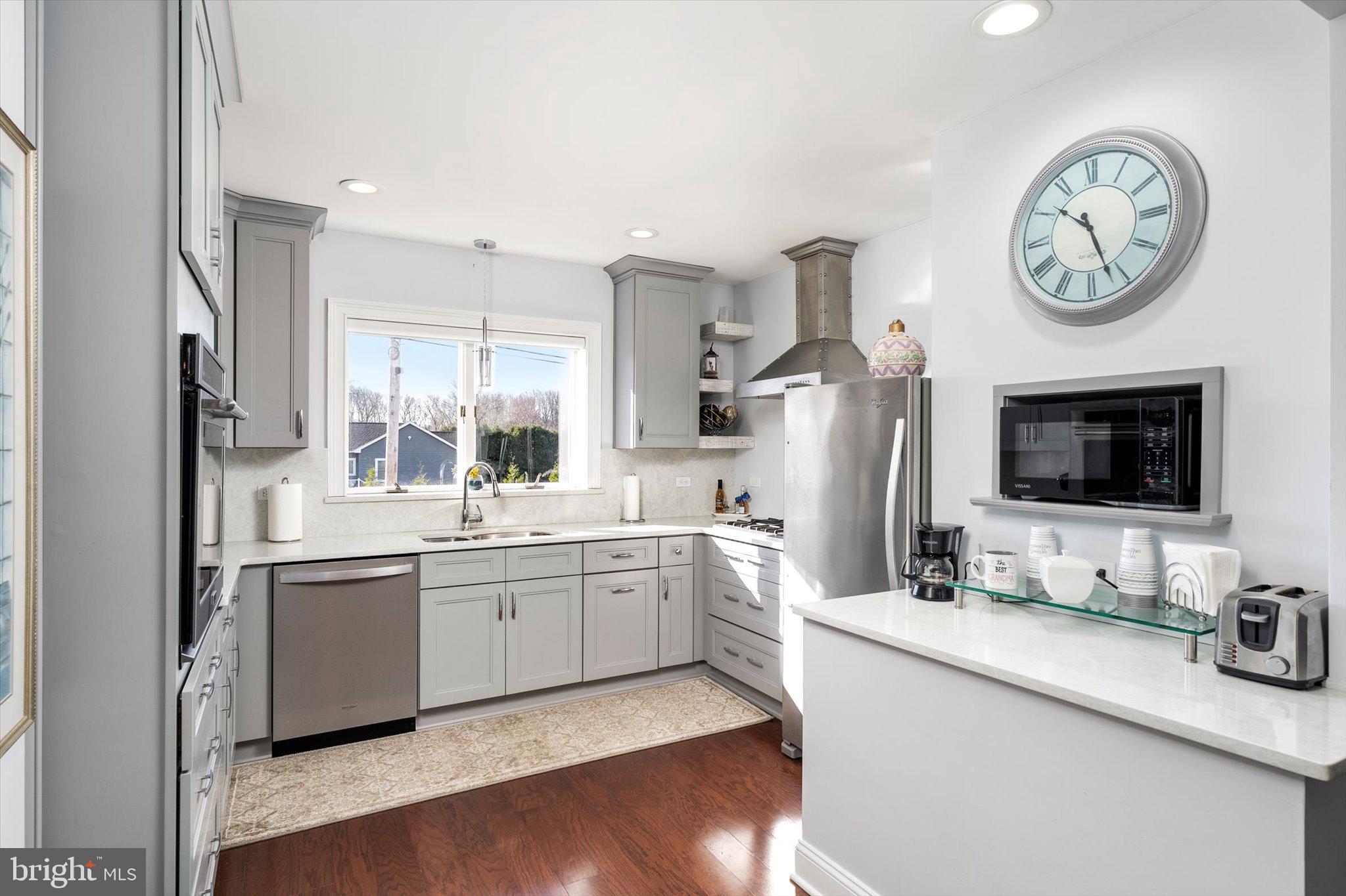 151 Walnford Road Allentown, NJ 08501 - Photo 5 of 49 a large kitchen with a large window and stainless steel appliances