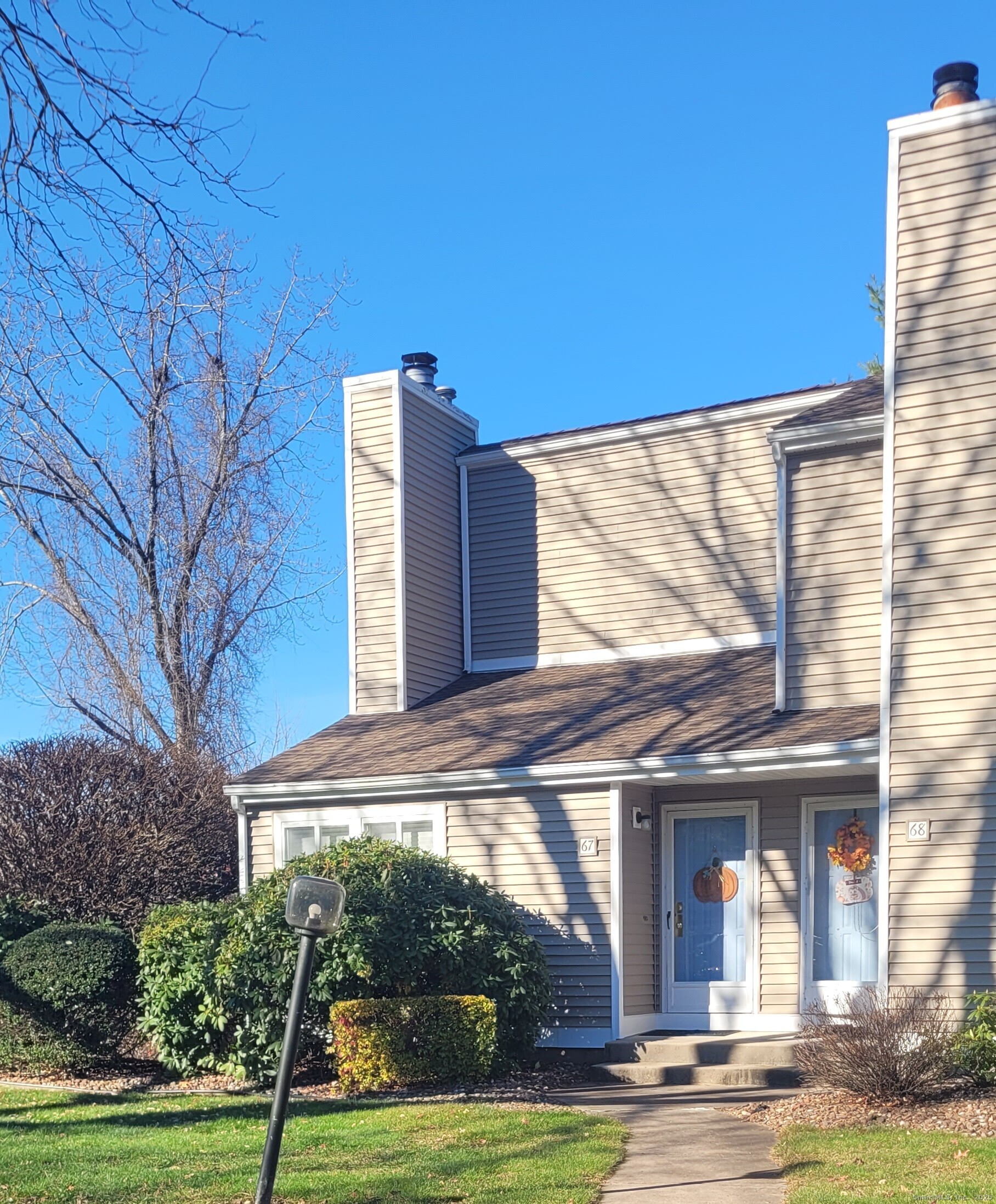 60 Old Town Road, Unit 67 Vernon, CT 06066 - Photo 1 of 1 a view of a building with a yard