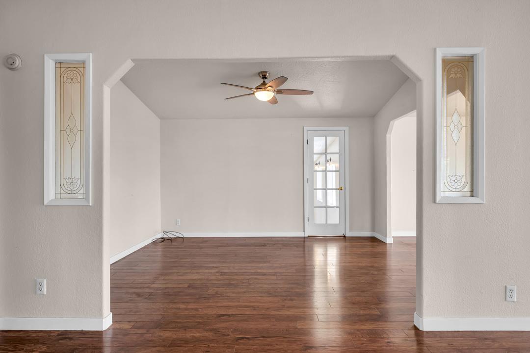 10721 Shenandoah Road Plymouth, CA 95669 - Photo 12 of 48 a view of an empty room with window and wooden floor