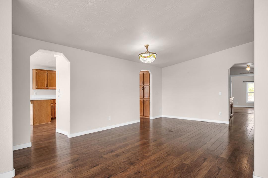 10721 Shenandoah Road Plymouth, CA 95669 - Photo 14 of 48 a view of an empty room with wooden floor and a window