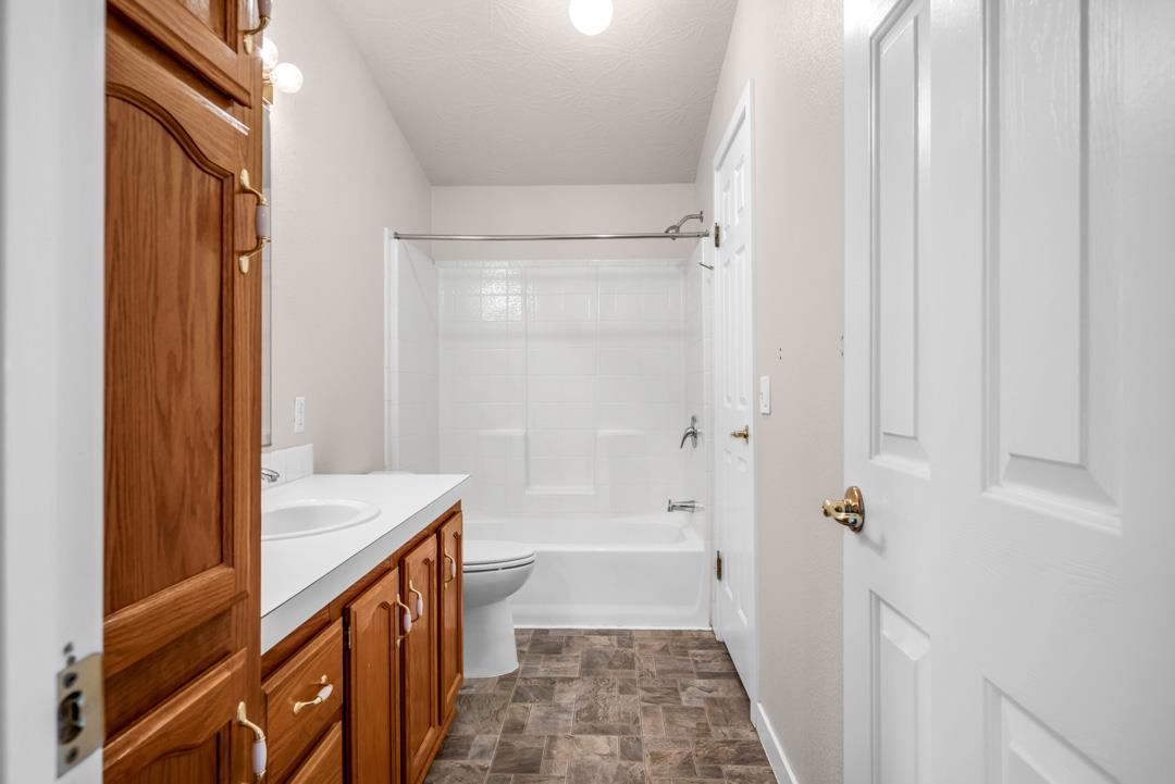 10721 Shenandoah Road Plymouth, CA 95669 - Photo 25 of 48 a bathroom with a sink a toilet and shower