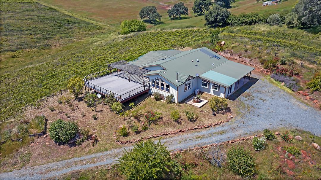 10721 Shenandoah Road Plymouth, CA 95669 - Photo 36 of 48 an aerial view of a house with a yard