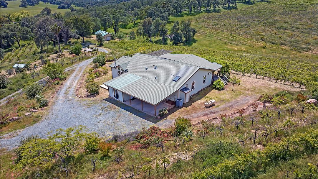 10721 Shenandoah Road Plymouth, CA 95669 - Photo 37 of 48 an aerial view of a house with a yard and lake view