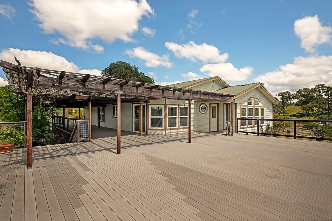 10721 Shenandoah Road Plymouth, CA 95669 - Photo 4 of 48 a view of a house with wooden deck