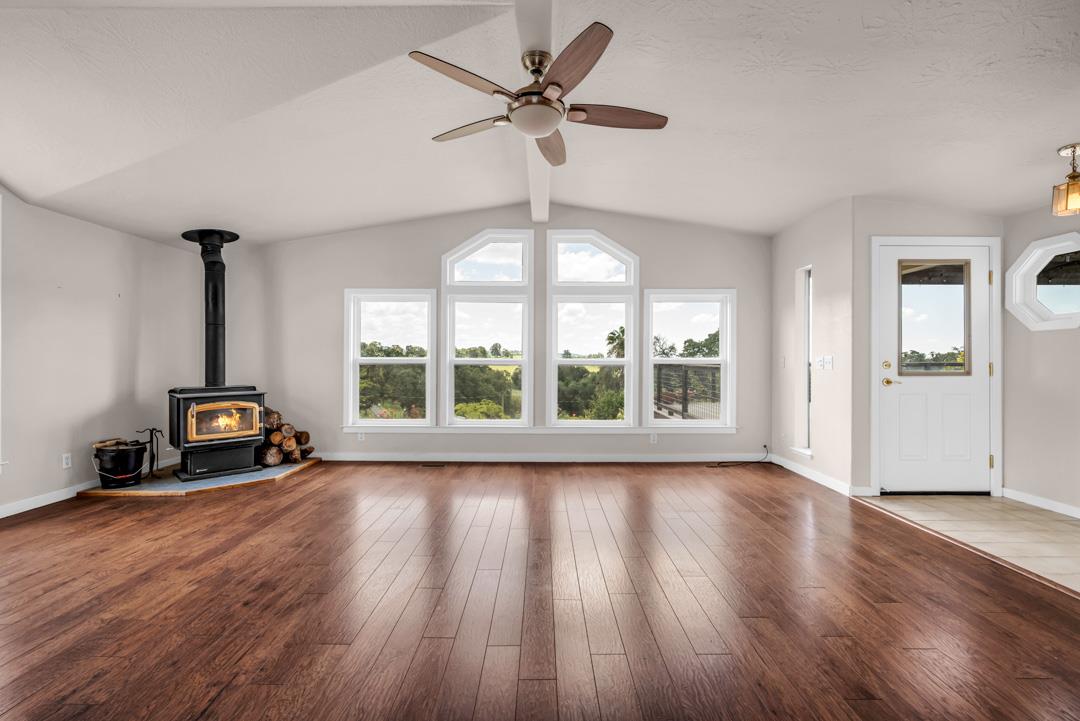 10721 Shenandoah Road Plymouth, CA 95669 - Photo 9 of 48 a view of room with window hardwood floor and ceiling fan