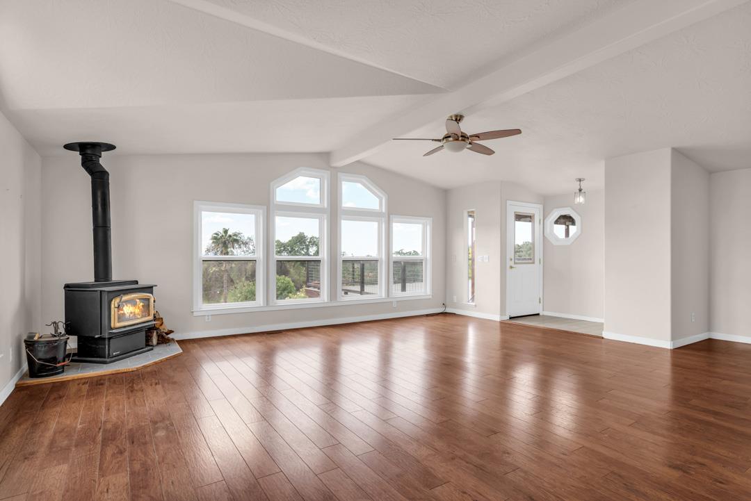 10721 Shenandoah Road Plymouth, CA 95669 - Photo 10 of 48 an empty room with wooden floor and windows