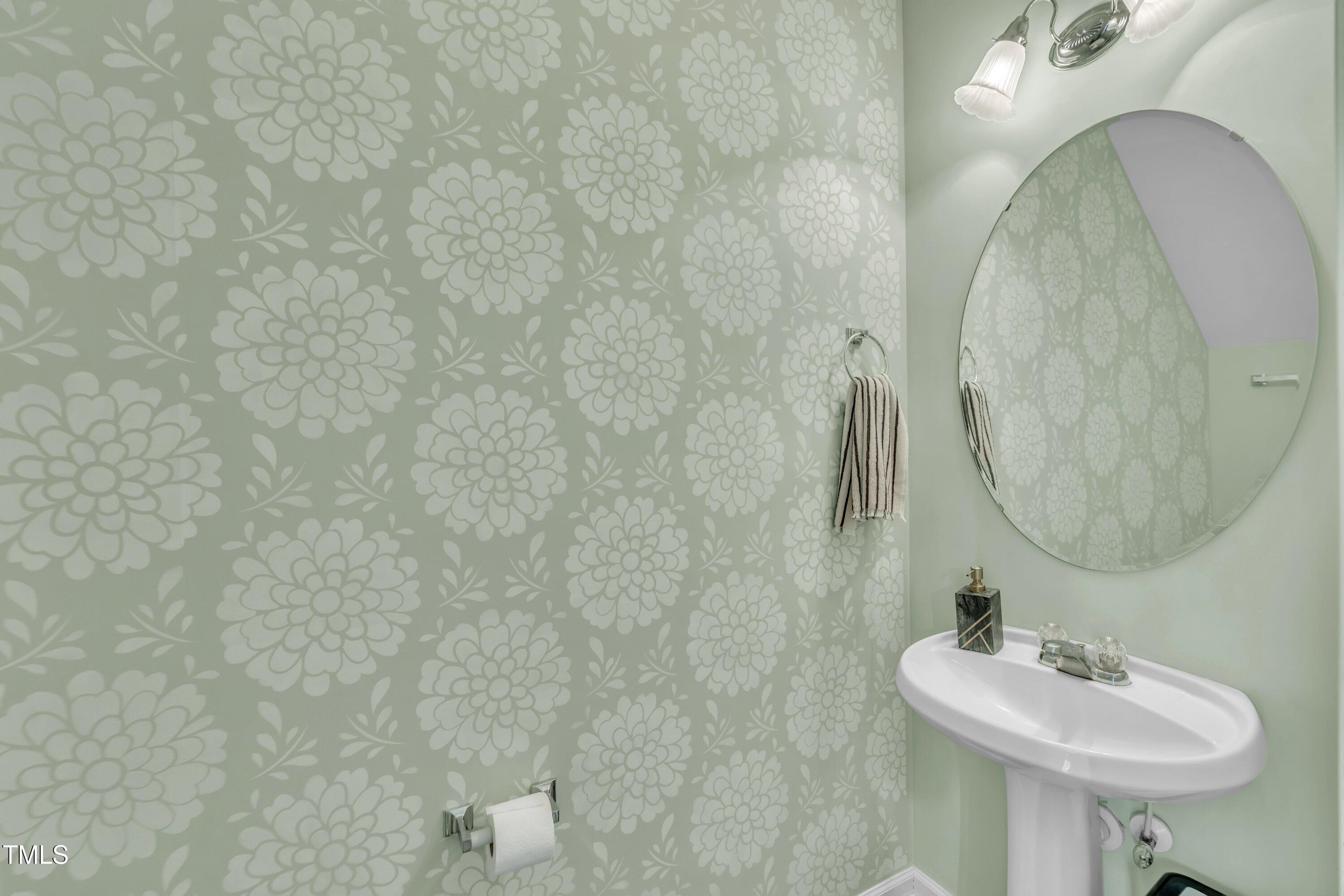 3583 Sugar Tree Place Durham, NC 27713 - Photo 20 of 50 a bathroom with a sink and a mirror