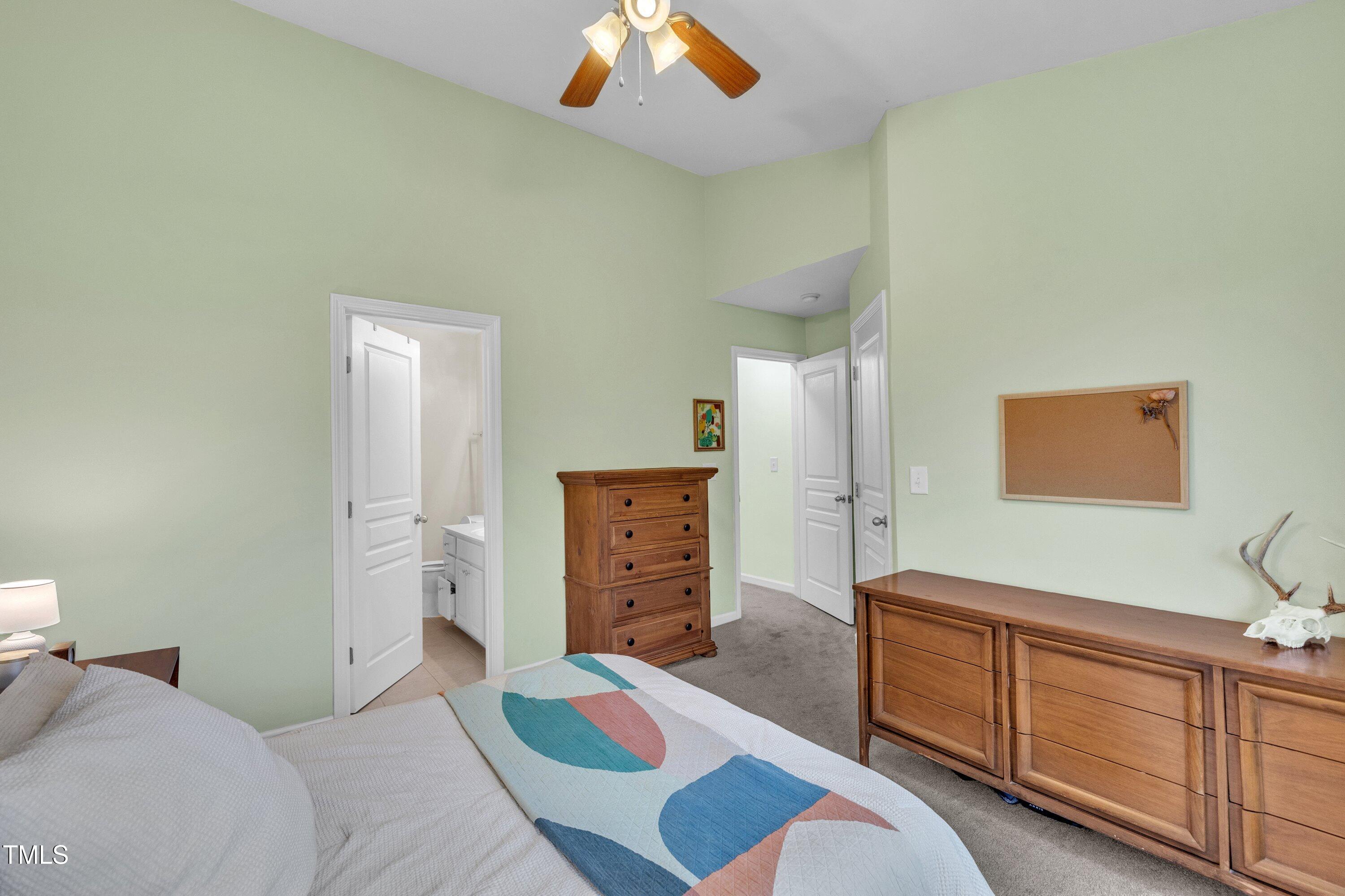 3583 Sugar Tree Place Durham, NC 27713 - Photo 23 of 50 a bedroom with a bed and a dresser