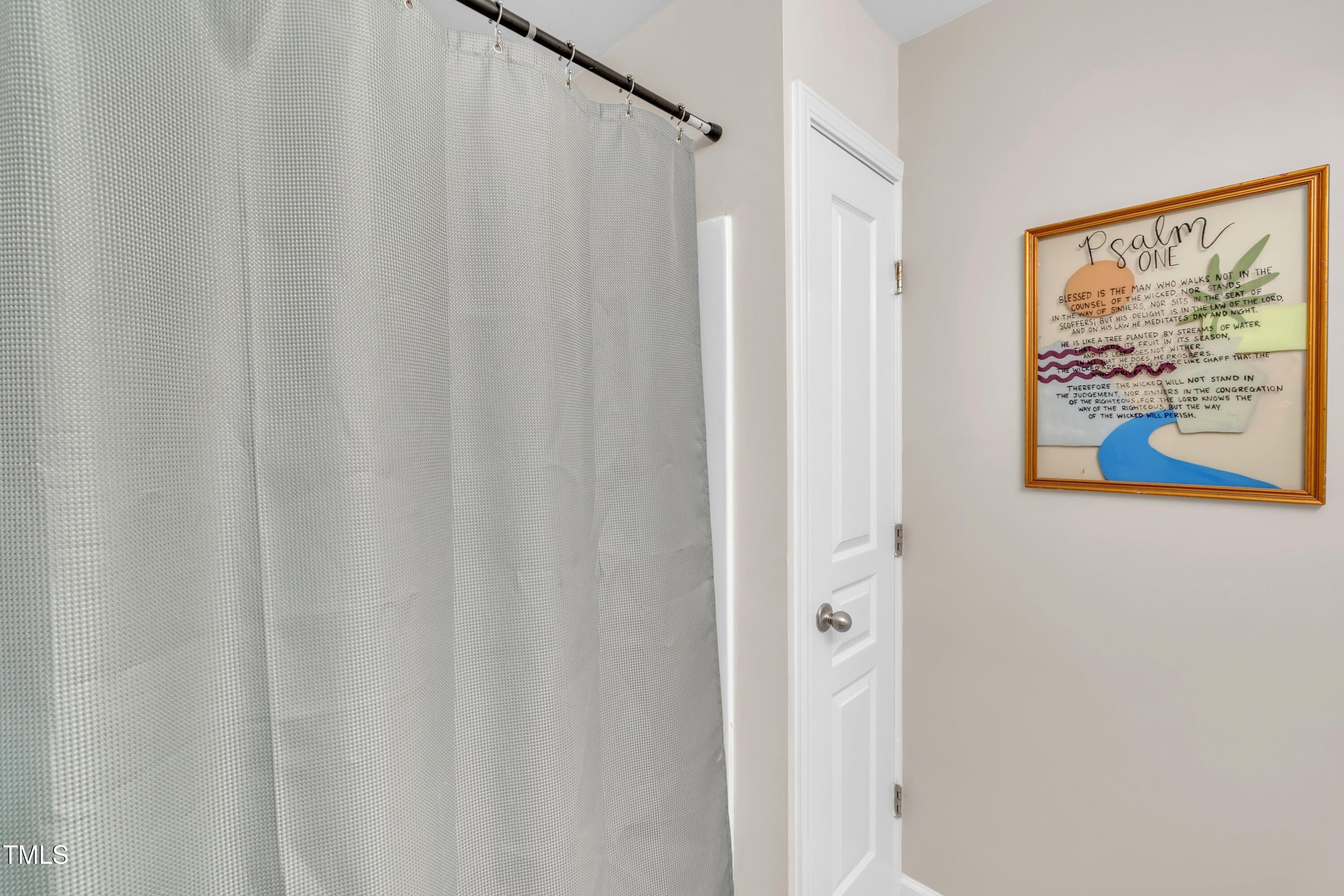 3583 Sugar Tree Place Durham, NC 27713 - Photo 26 of 50 a bathroom with a shower and a shower curtain