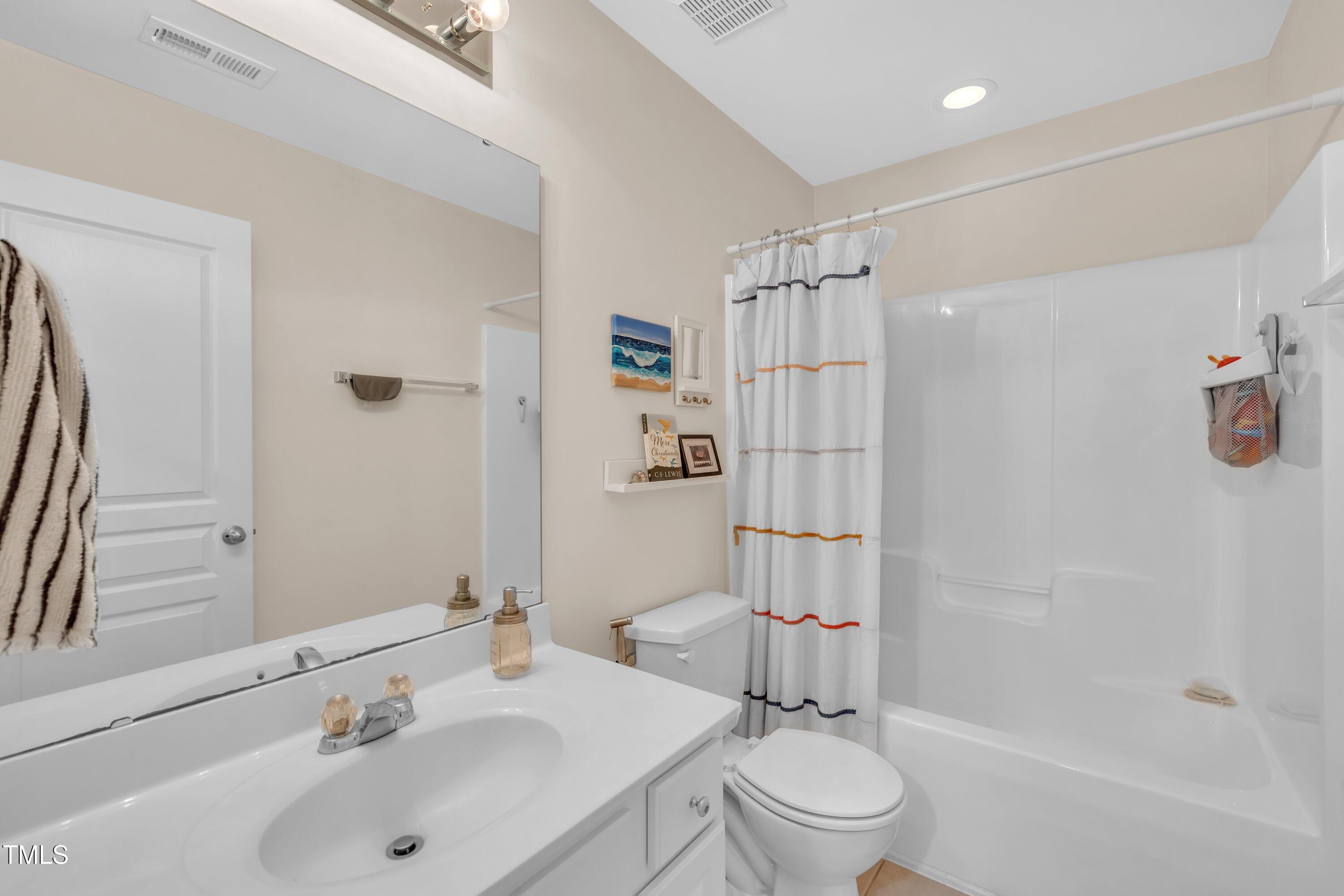 3583 Sugar Tree Place Durham, NC 27713 - Photo 28 of 50 a bathroom with a sink toilet and shower