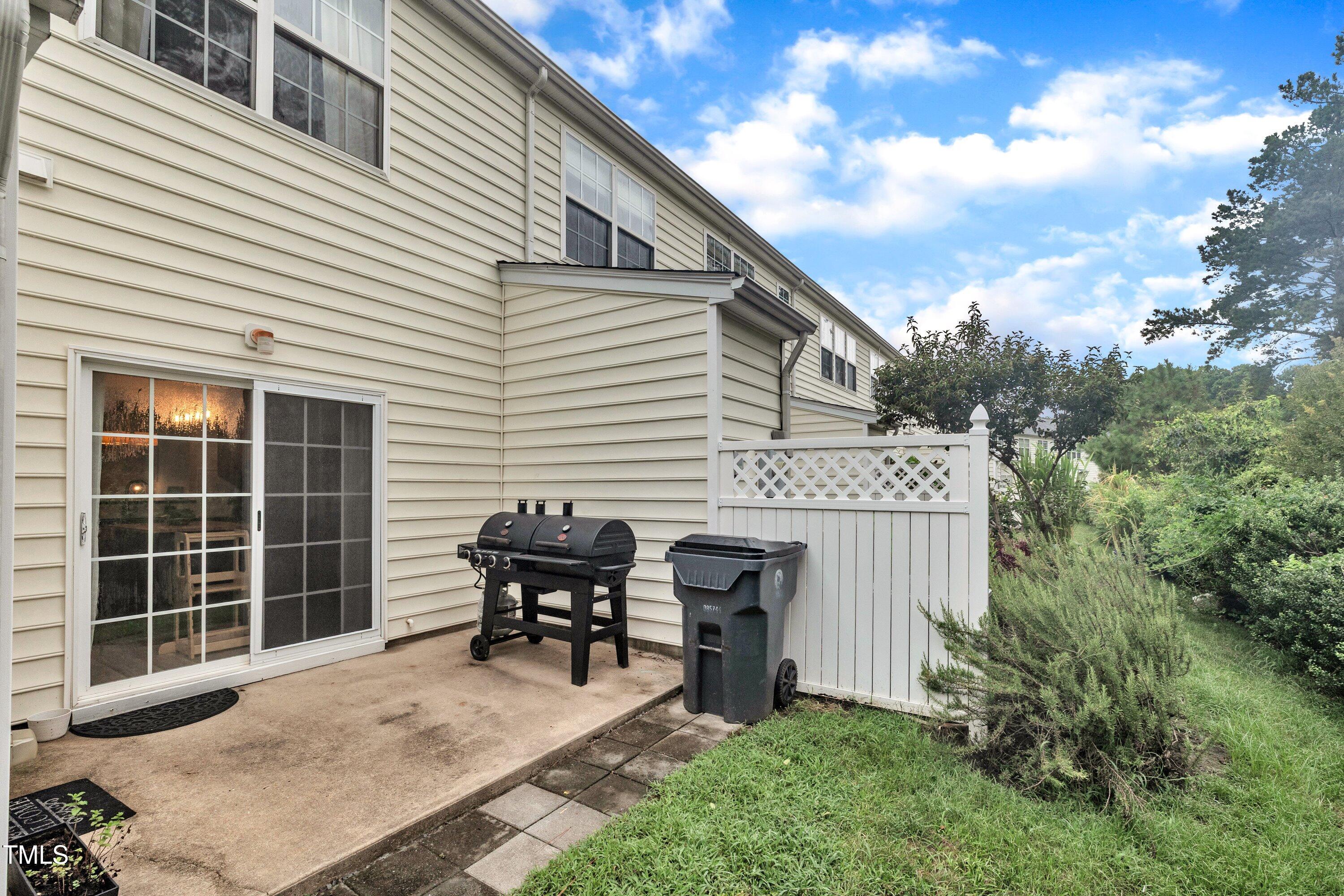 3583 Sugar Tree Place Durham, NC 27713 - Photo 33 of 50 a view of backyard with seating space and wooden fence