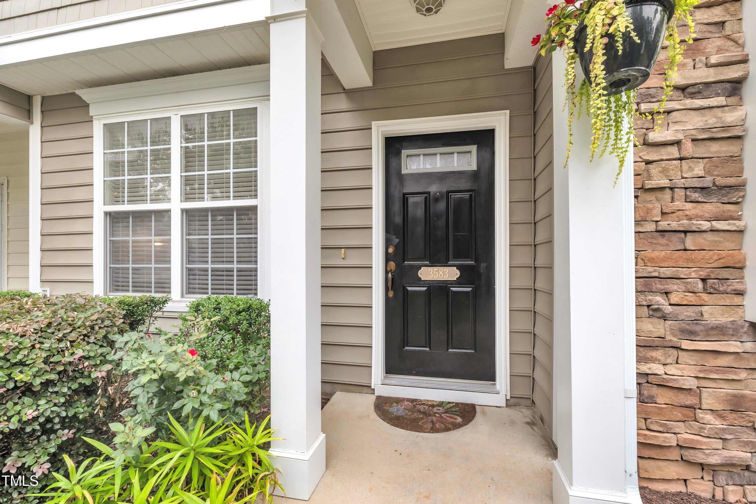 3583 Sugar Tree Place Durham, NC 27713 - Photo 4 of 50 front view of a house with a window and a potted plant