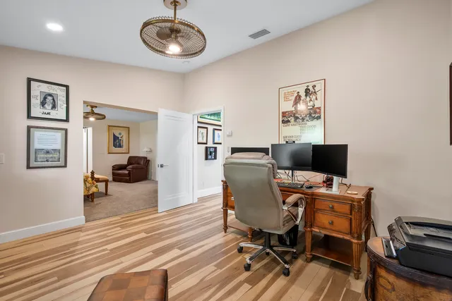 a bathroom with a granite countertop sink toilet a mirror and shower
