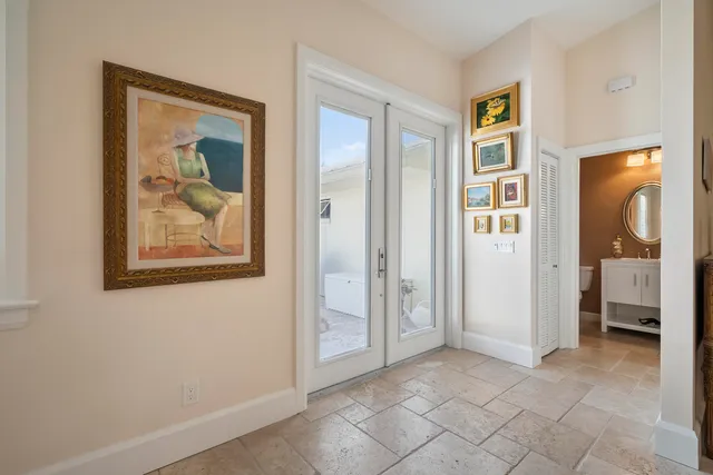 a living room with furniture a window and a ceiling fan
