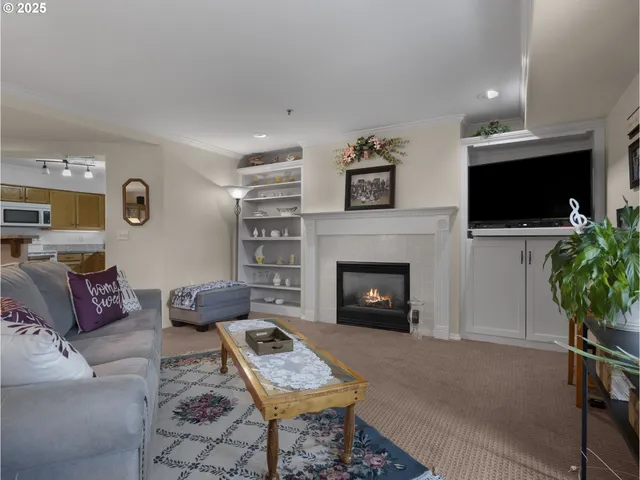 a view of a livingroom with furniture and a fireplace