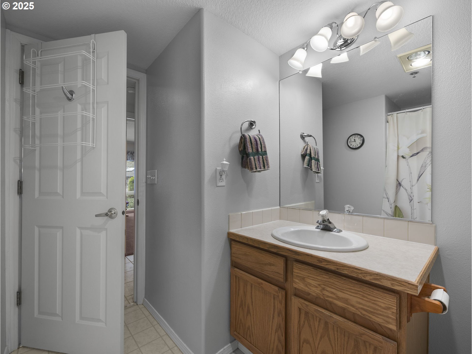 15530 Northeast Knott Street, Unit 32 Portland, OR 97230 - Photo 37 of 48 a bathroom with a sink vanity and a mirror