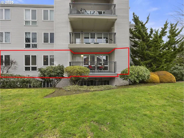a view of a porch with a table and chairs next to a yard