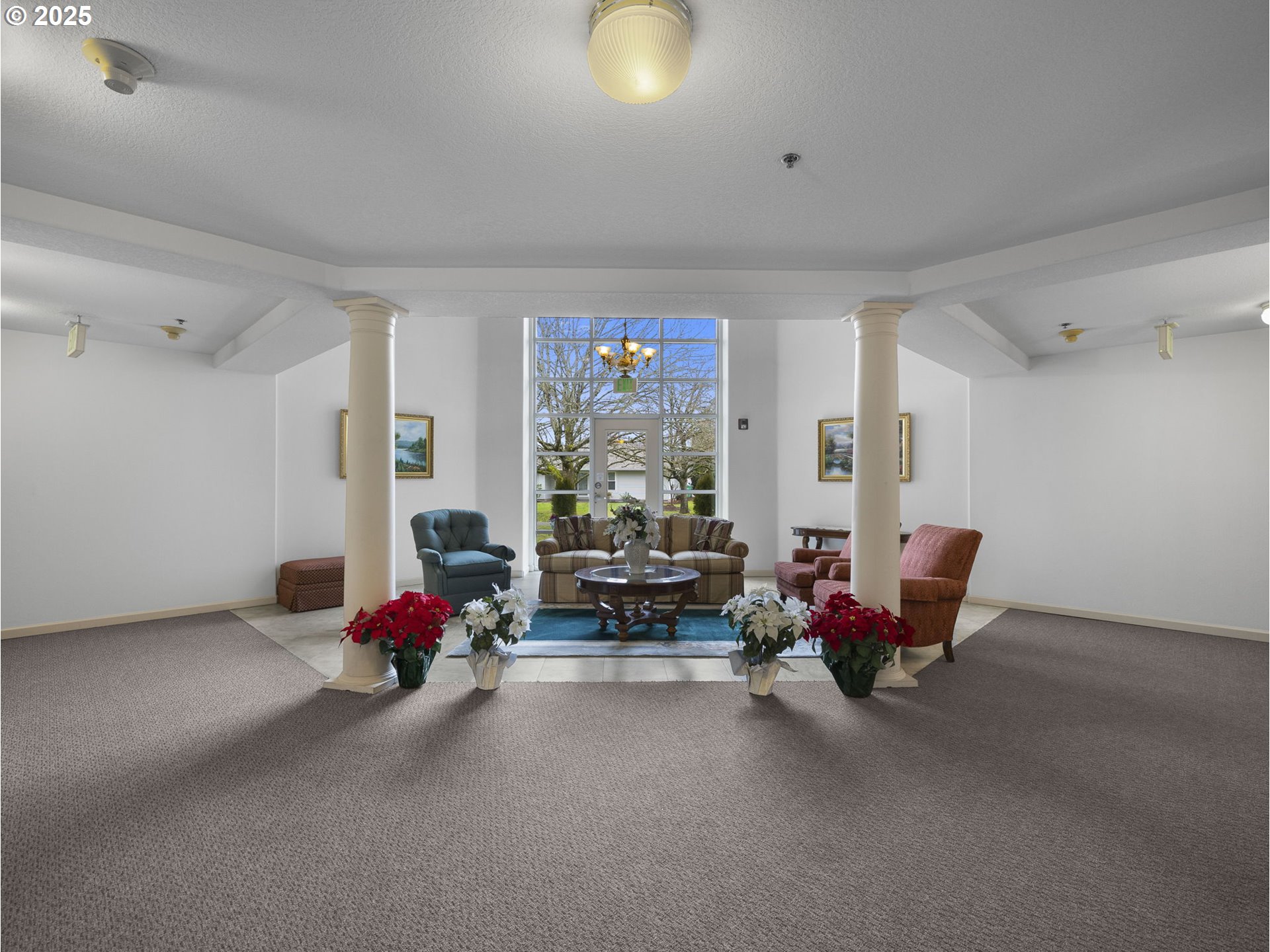 15530 Northeast Knott Street, Unit 32 Portland, OR 97230 - Photo 43 of 48 a living room with furniture and a floor to ceiling window