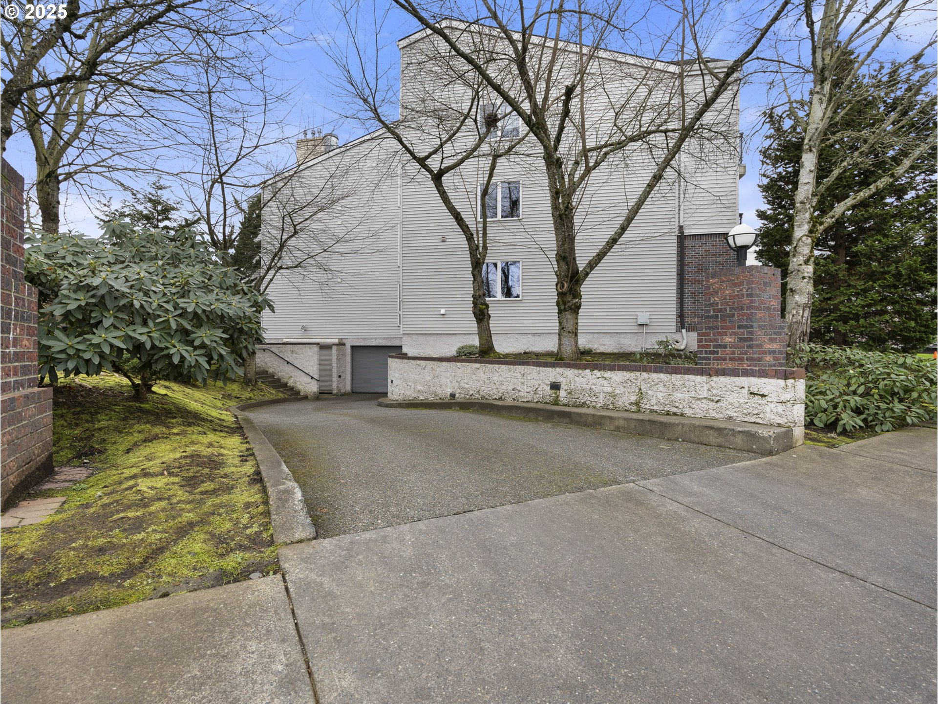15530 Northeast Knott Street, Unit 32 Portland, OR 97230 - Photo 44 of 48 a white house that has a tree in front of it