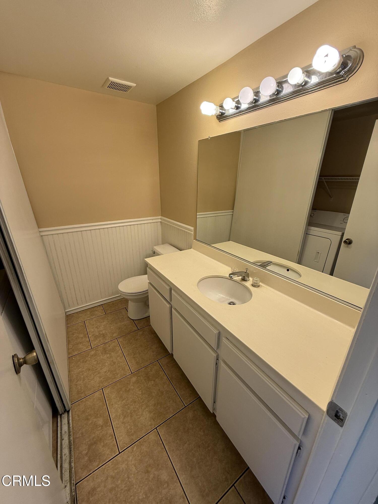 5209 Perkins Road Oxnard, CA 93033 - Photo 13 of 28 a bathroom with a sink a toilet and shower