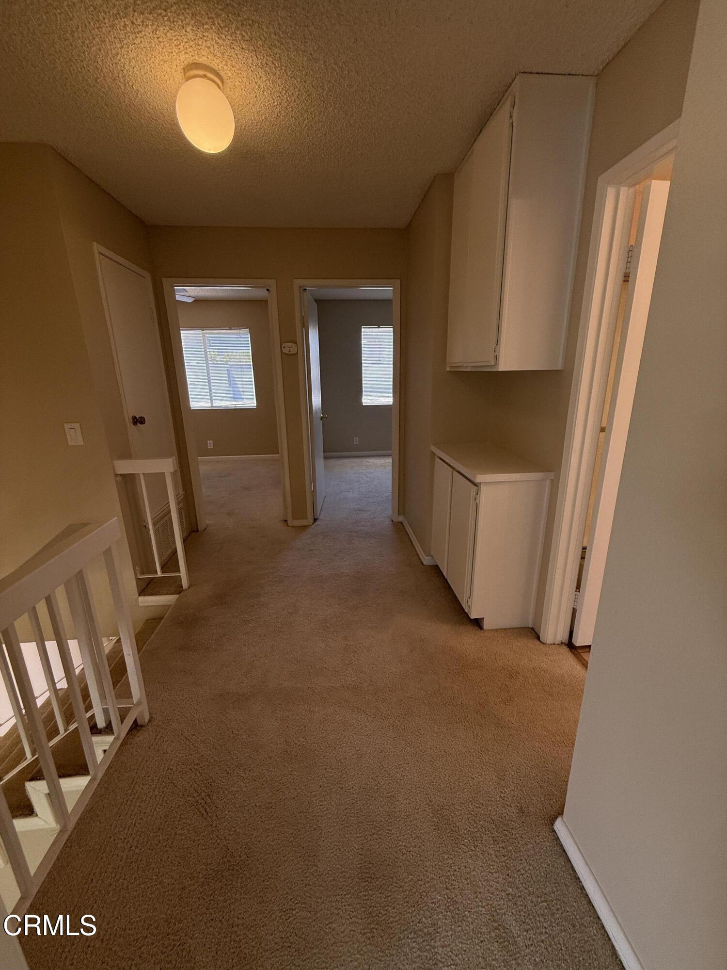 5209 Perkins Road Oxnard, CA 93033 - Photo 21 of 28 a view of hallway with furniture and a window
