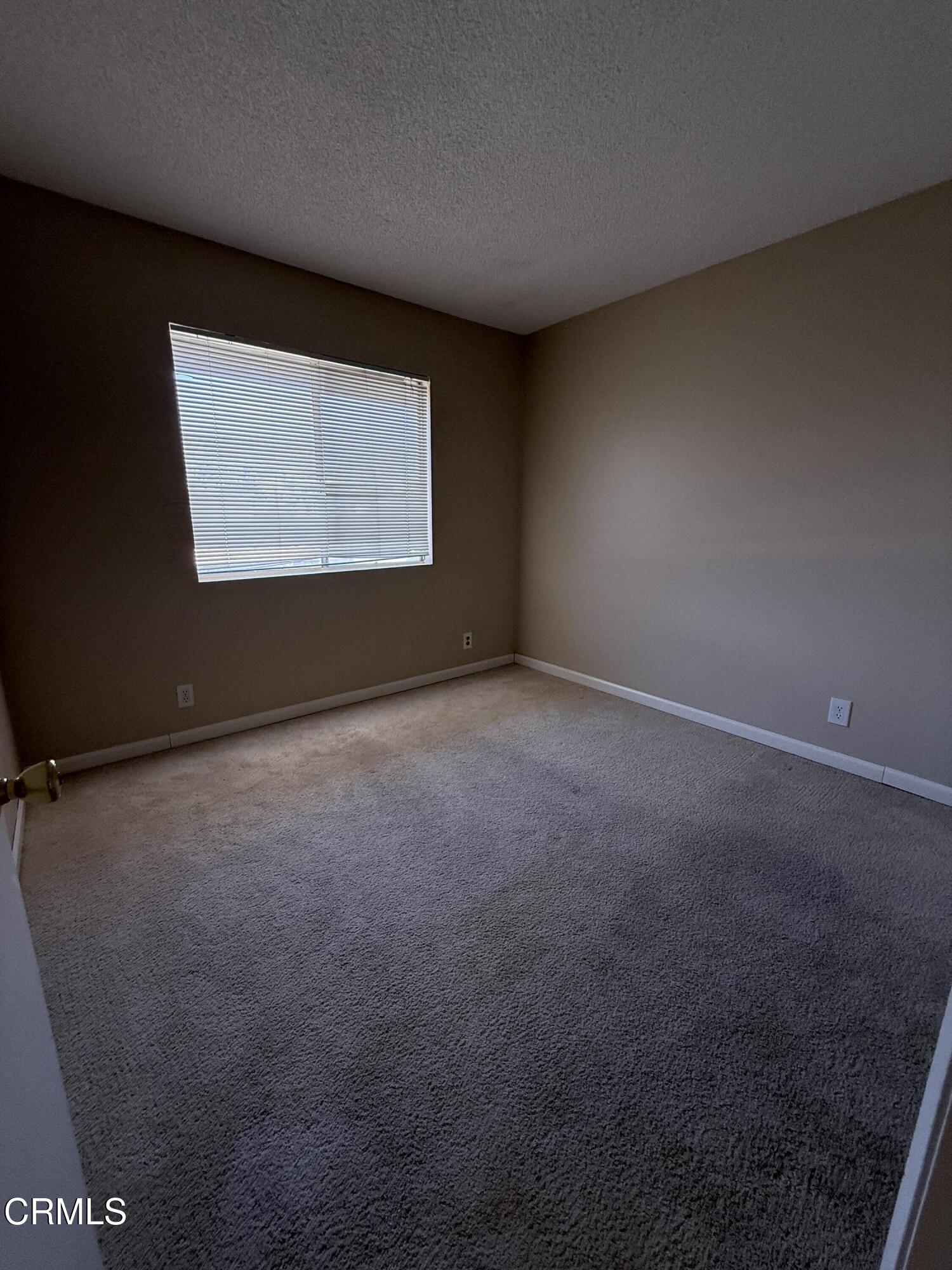 5209 Perkins Road Oxnard, CA 93033 - Photo 25 of 28 a view of an empty room with a window