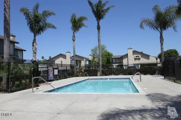 a view of a swimming pool and a chair