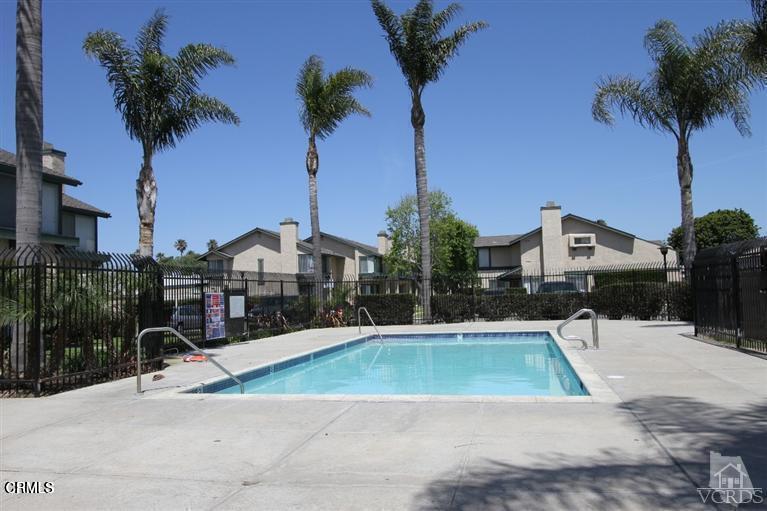 5209 Perkins Road Oxnard, CA 93033 - Photo 3 of 28 a view of a swimming pool and a chair