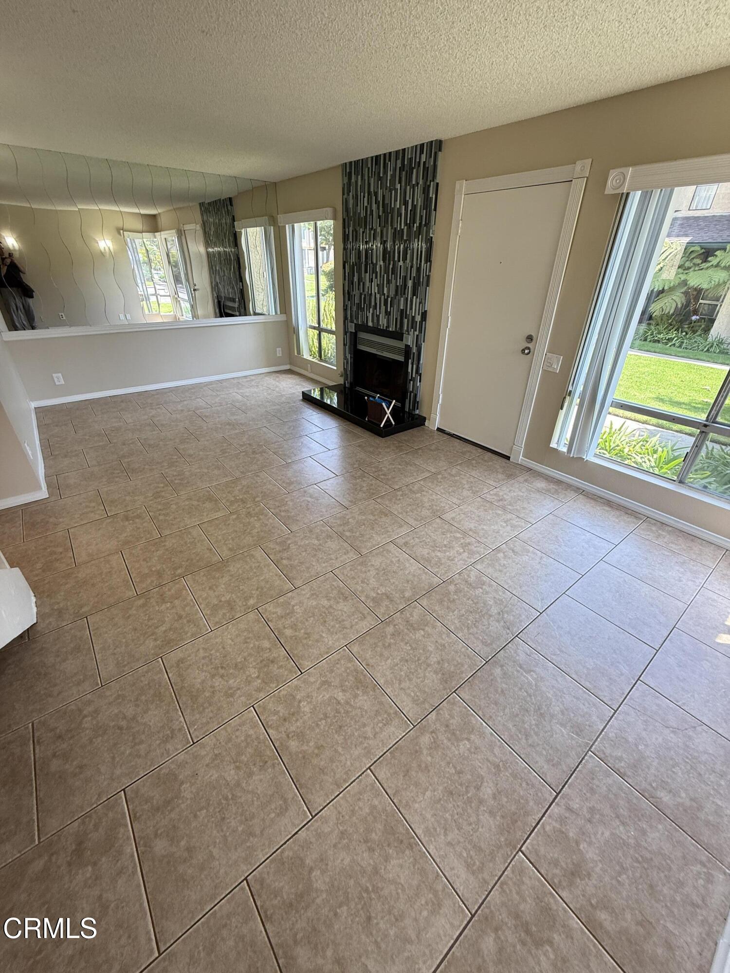 5209 Perkins Road Oxnard, CA 93033 - Photo 4 of 28 a view of an empty room with window and stairs