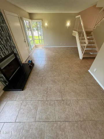 a view of an empty room with windows