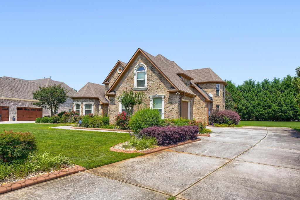 345 Masters Club Boulevard Hampton, GA 30228 - Photo 4 of 30 a front view of a house with a yard