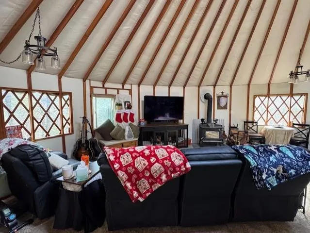 a dining room with furniture and a window