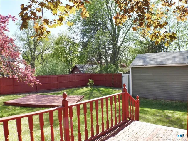 a view of a street with a tree