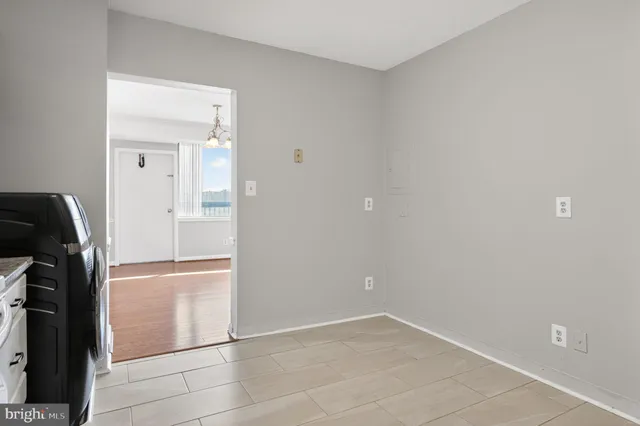 a view of an empty room with a window