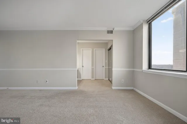 a view of an empty walk in closet