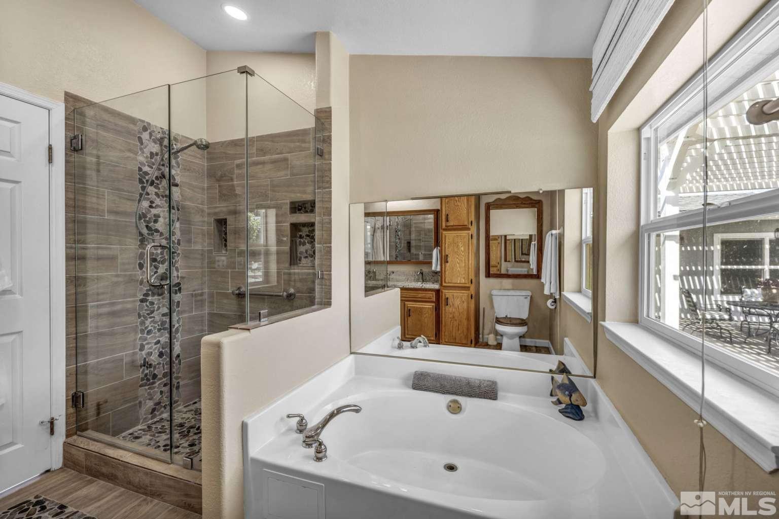 160-180 Quarter Horse Circle Reno, NV 89508 - Photo 12 of 23 a bathroom with a bathtub and a shower