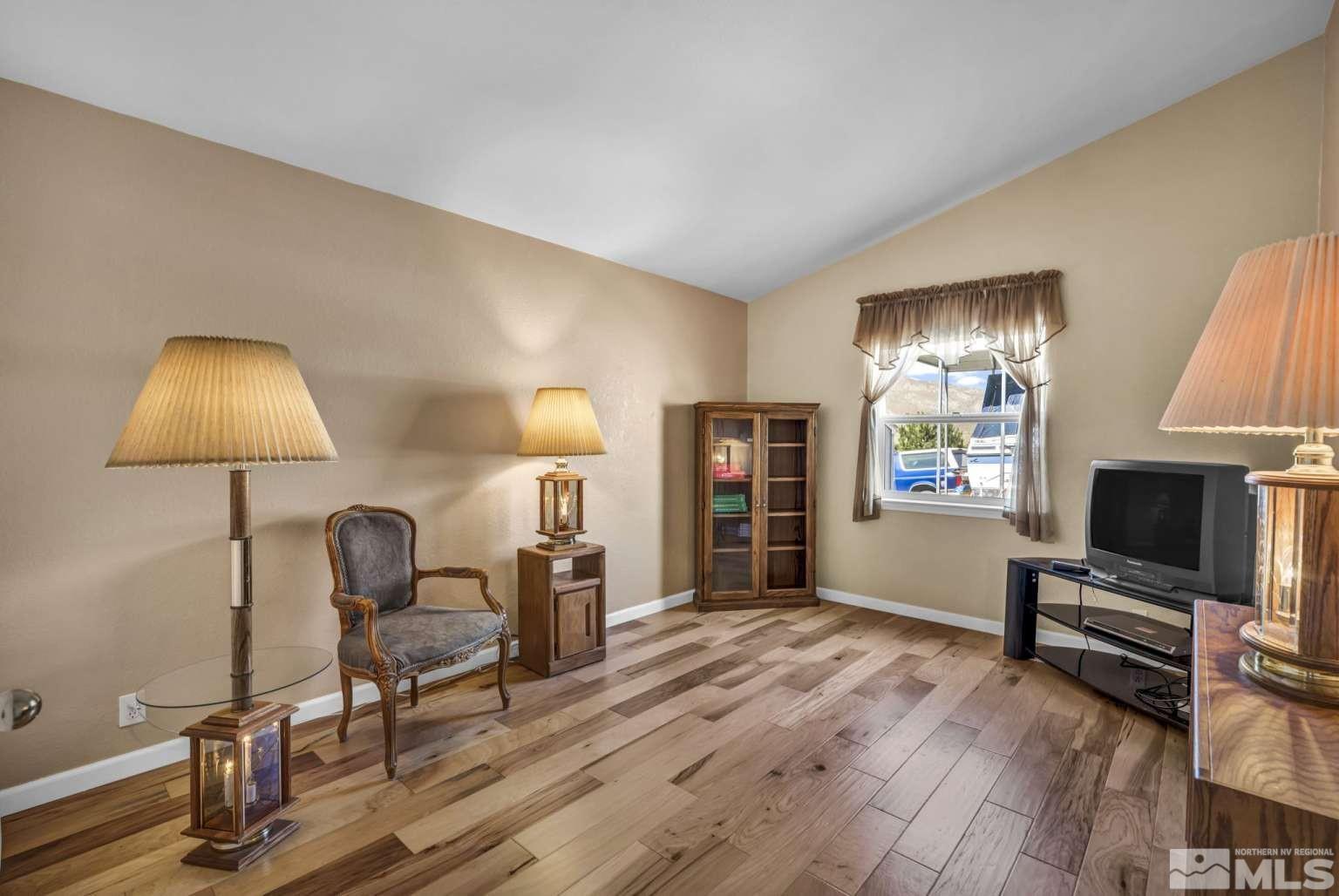 160-180 Quarter Horse Circle Reno, NV 89508 - Photo 13 of 23 a living room with furniture and a flat screen tv
