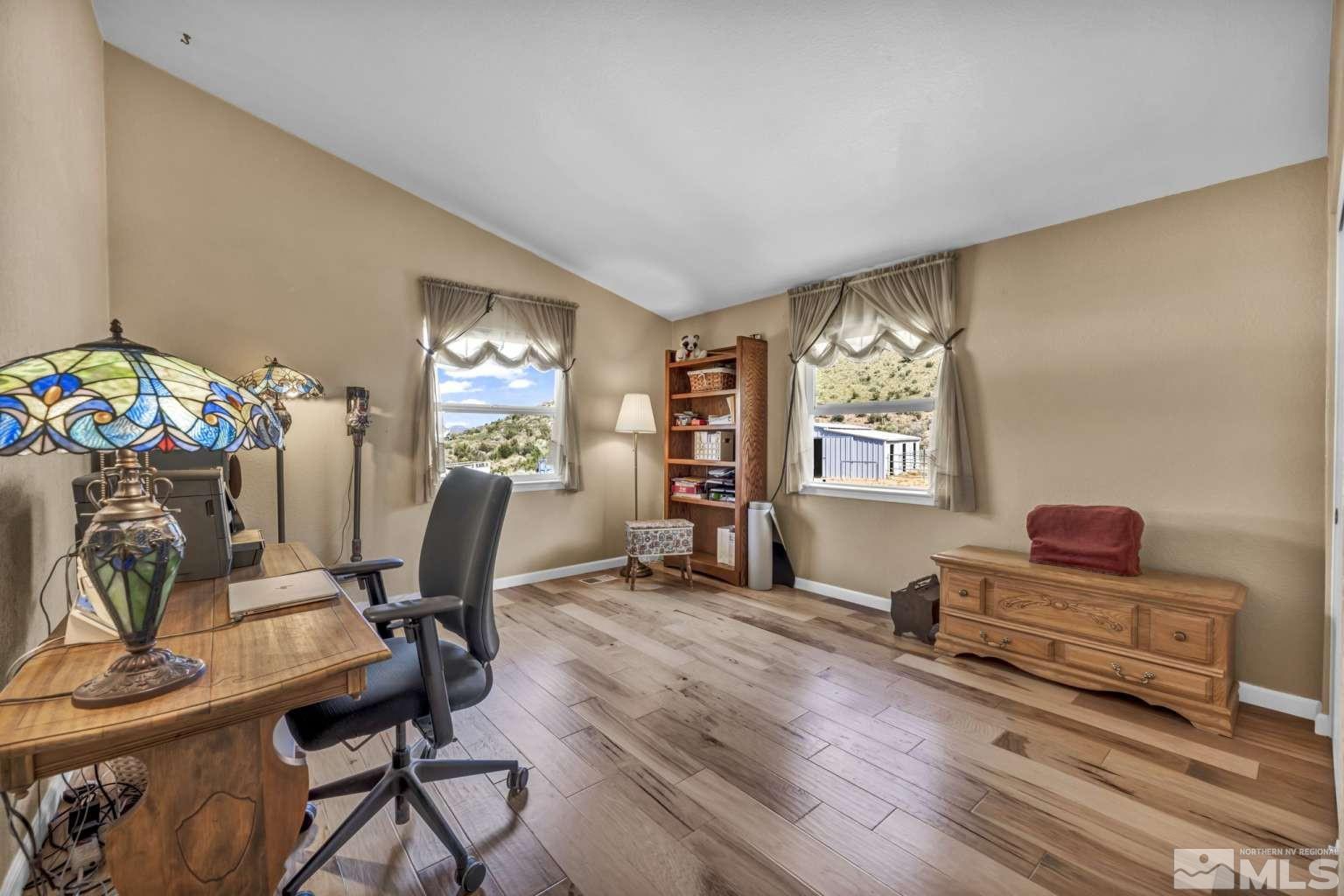 160-180 Quarter Horse Circle Reno, NV 89508 - Photo 14 of 23 a view of a workspace with furniture and a window