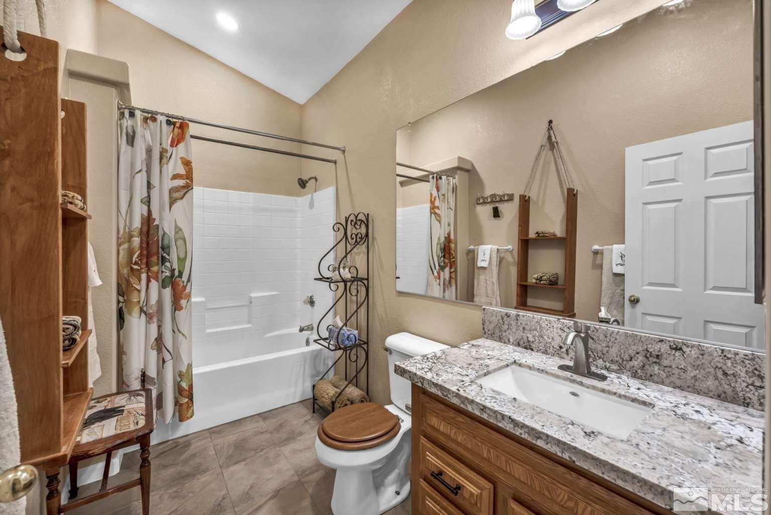 160-180 Quarter Horse Circle Reno, NV 89508 - Photo 15 of 23 a bathroom with a granite countertop sink toilet and shower