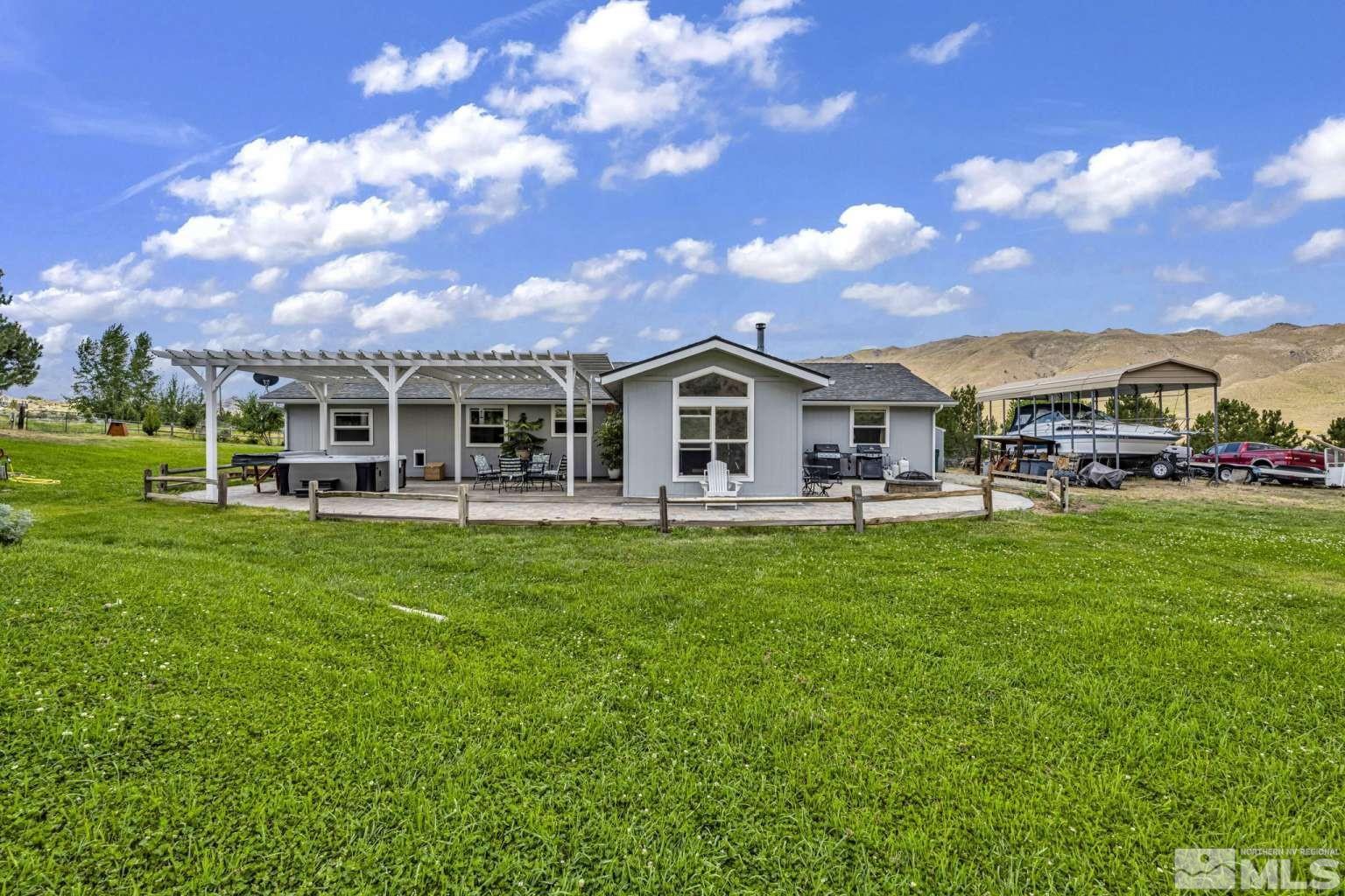 160-180 Quarter Horse Circle Reno, NV 89508 - Photo 17 of 23 a view of a house with a backyard porch and sitting area